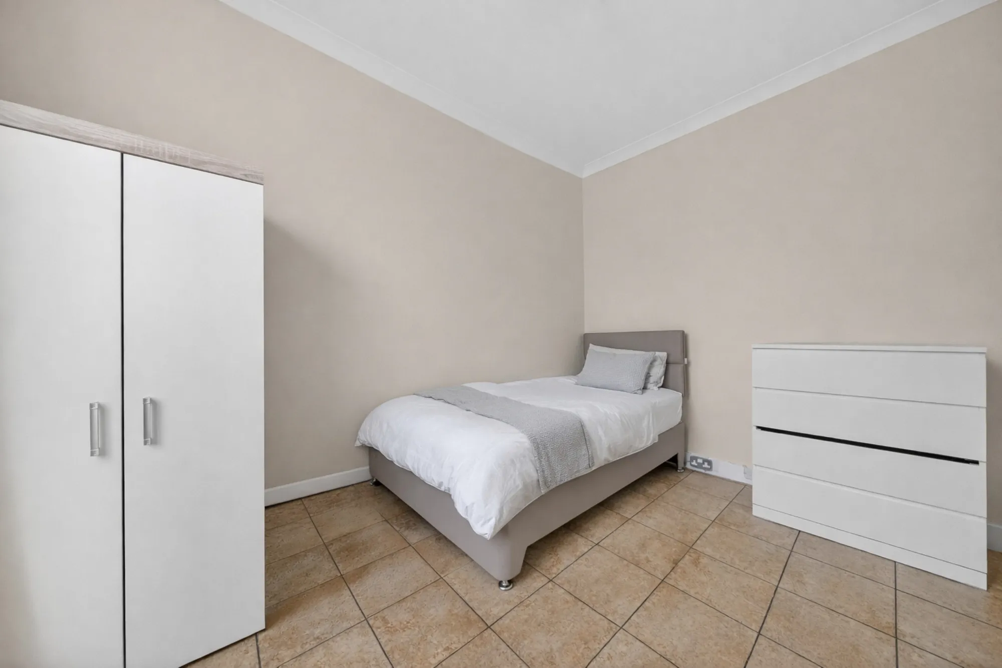  Private single bedroom with wardrobe and storage for residents at Pinfold Care Home